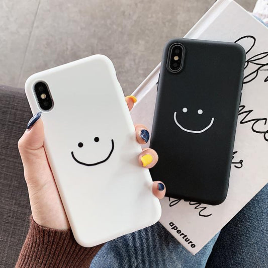 Coque iPhone en silicone souple visage souriant de couleur unie